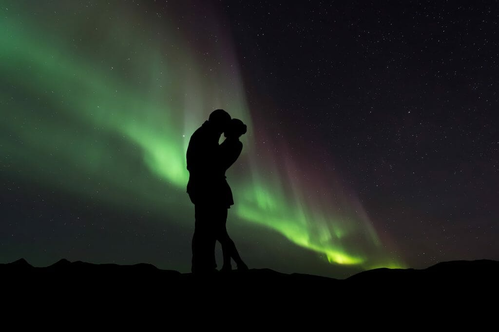 Silhouette Of A Couple With The Northern Lights