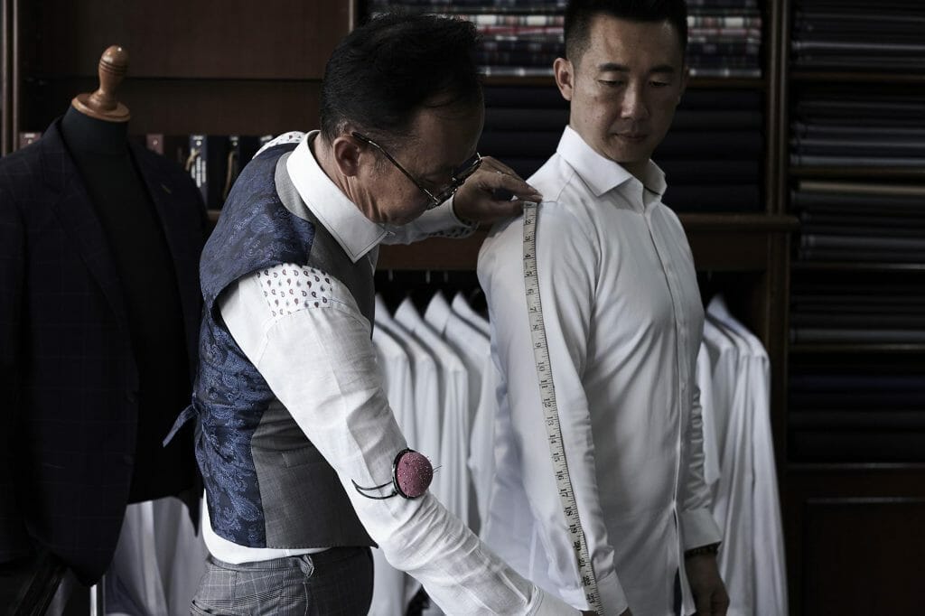 Ck Chang Being Measured By A Tailor