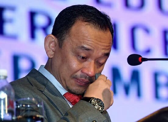Education minister Maszlee wiping away tears