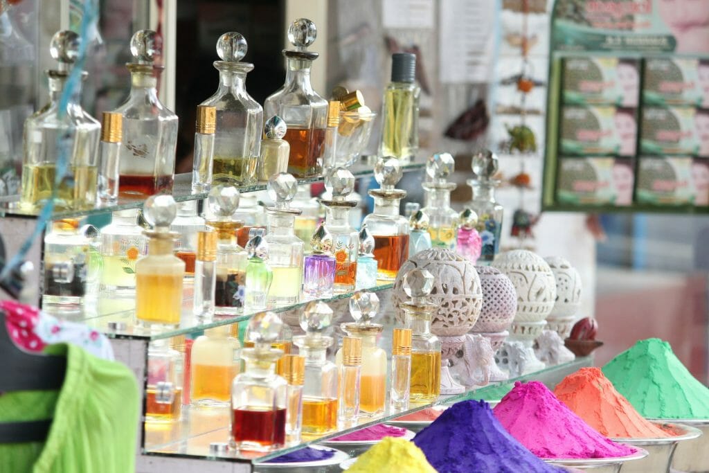 Colourful Shelf Filled With Various Perfumes And Spices