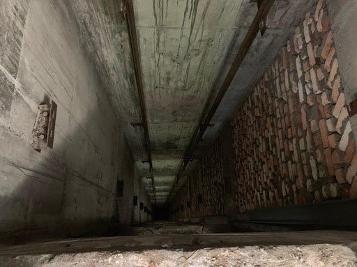 The elevator shaft, with no elevator or elevator cables visible.