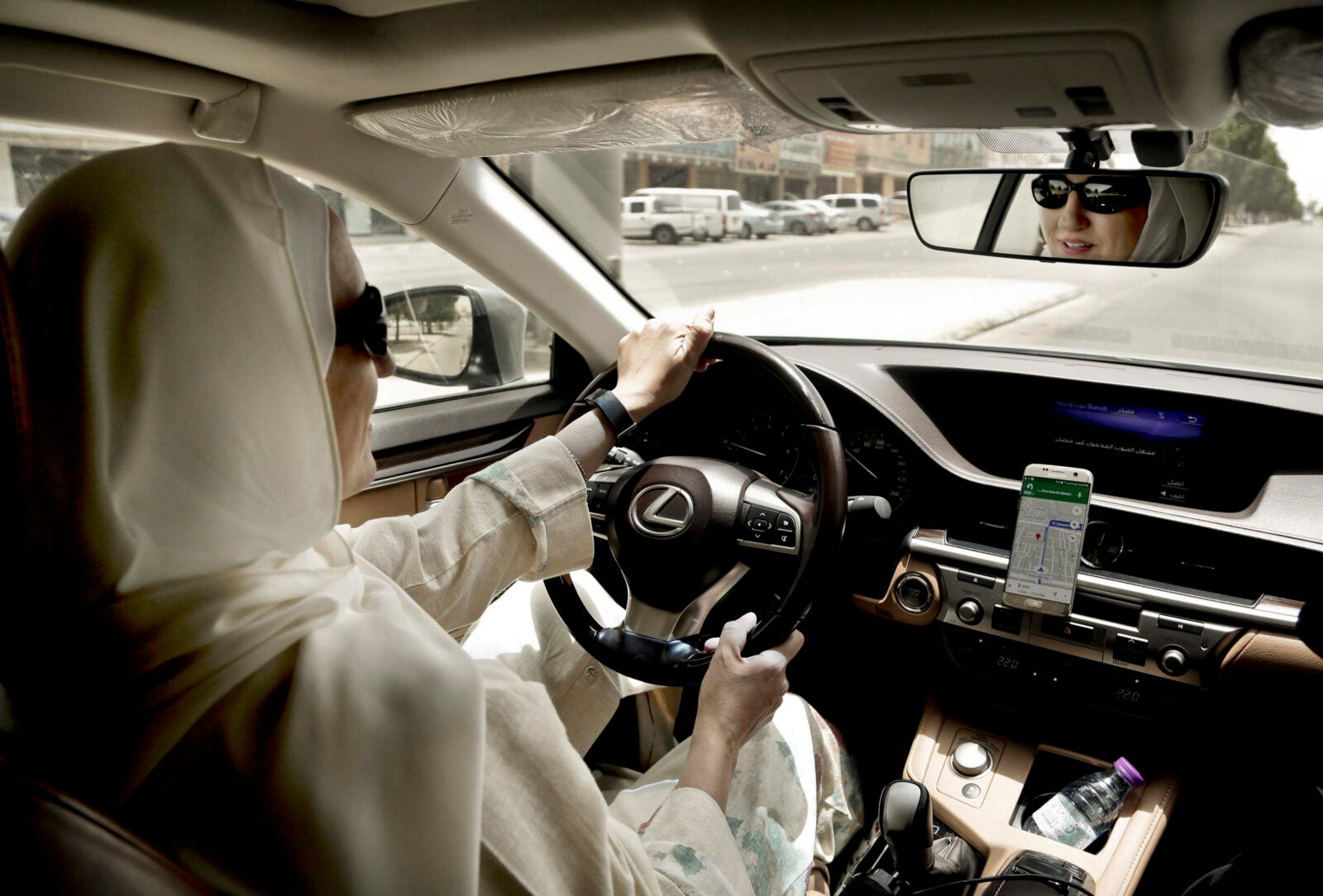 In this Sunday, June 24, 2018 photo, Ammal Farahat, who has signed up to be a driver for Careem, a regional ride-hailing service that is a competitor to Uber, drives her car in Riyadh, Saudi Arabia. After lifting a longstanding ban on women driving, it's the latest job opening for Saudi women, that had been reserved for men only, and one that sharply challenges traditional norms. (AP Photo/Nariman El-Mofty)