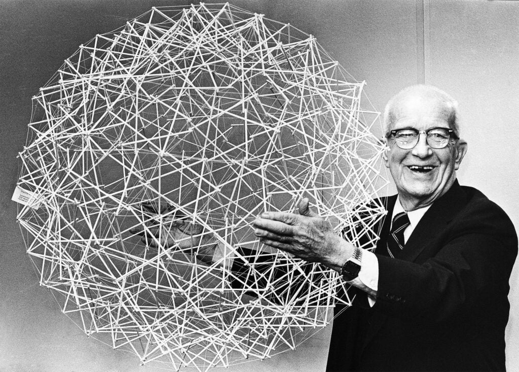 Buckminster Fuller with his patented molecule, the buckminsterfullerene.