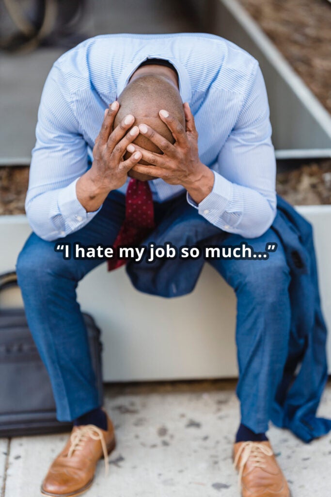 man clutching head in hands, suffering burnout, saying, "I hate my job so much..."