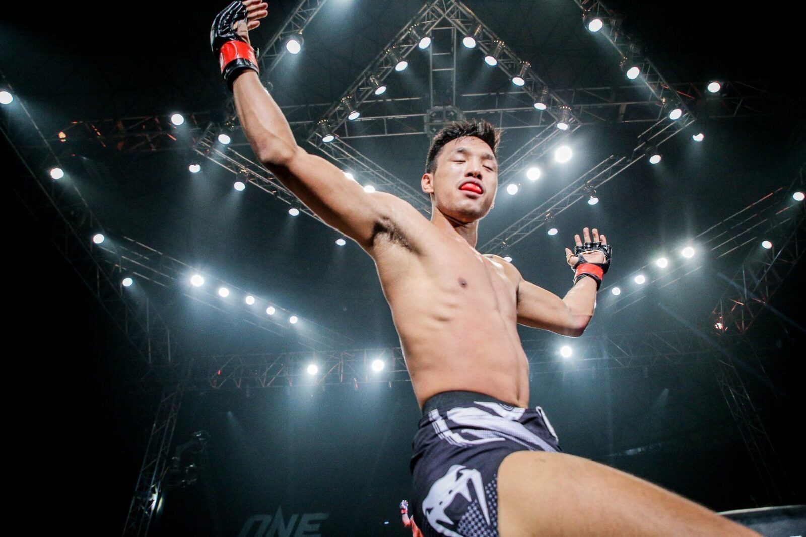 Keanu Subba during one of his boxing matches posing victoriously.