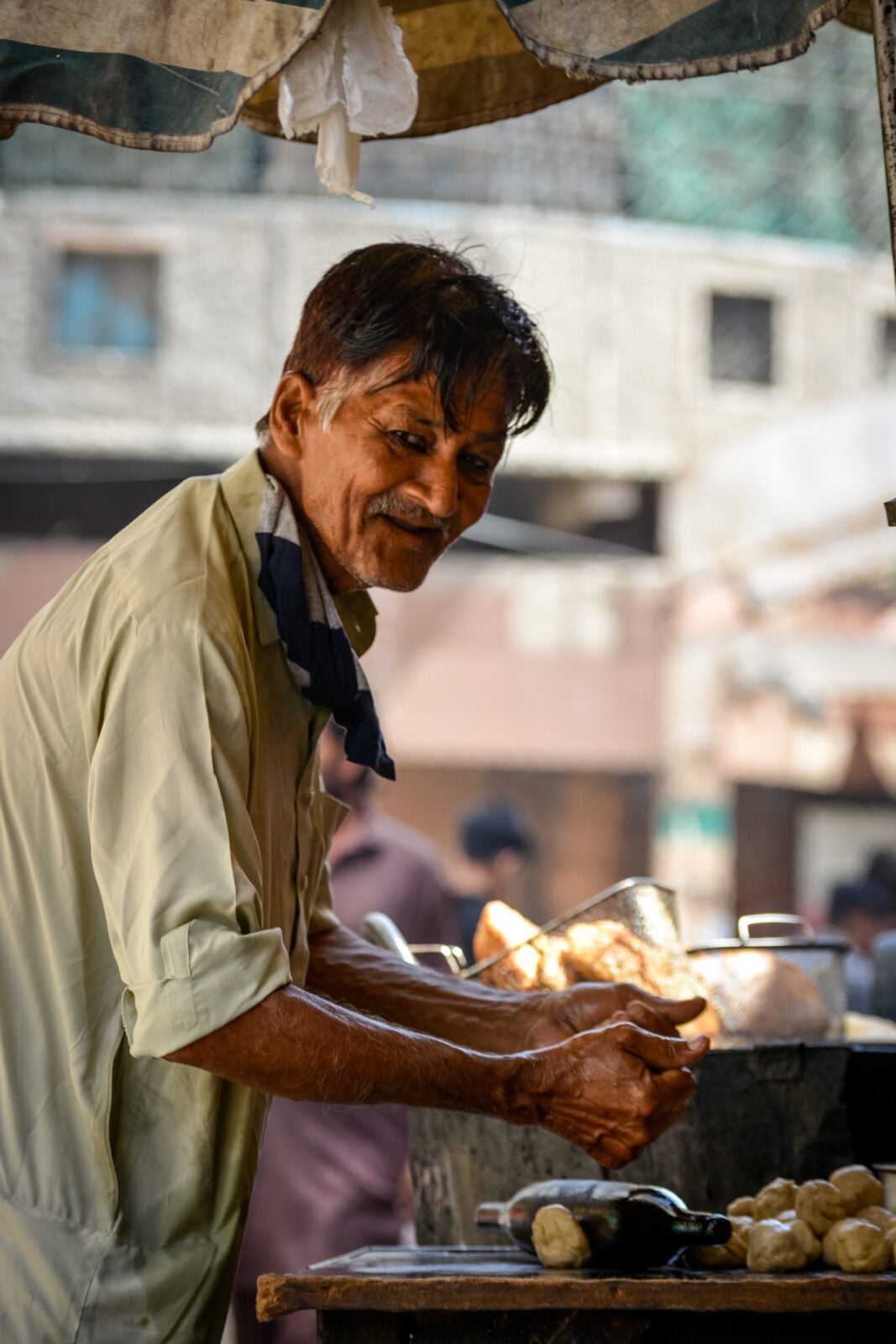 Photo of an Elderly Man Working