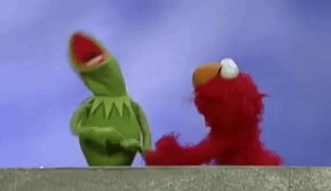 Kermit the Frog and Elmo arguing with each other.
