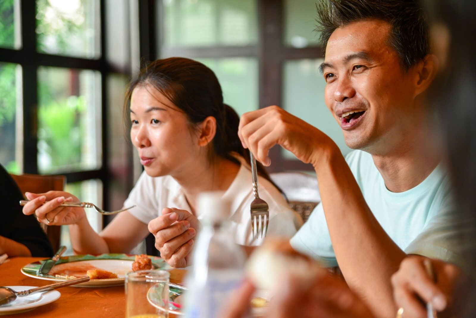A Chinese Couple Eating Happily Together.