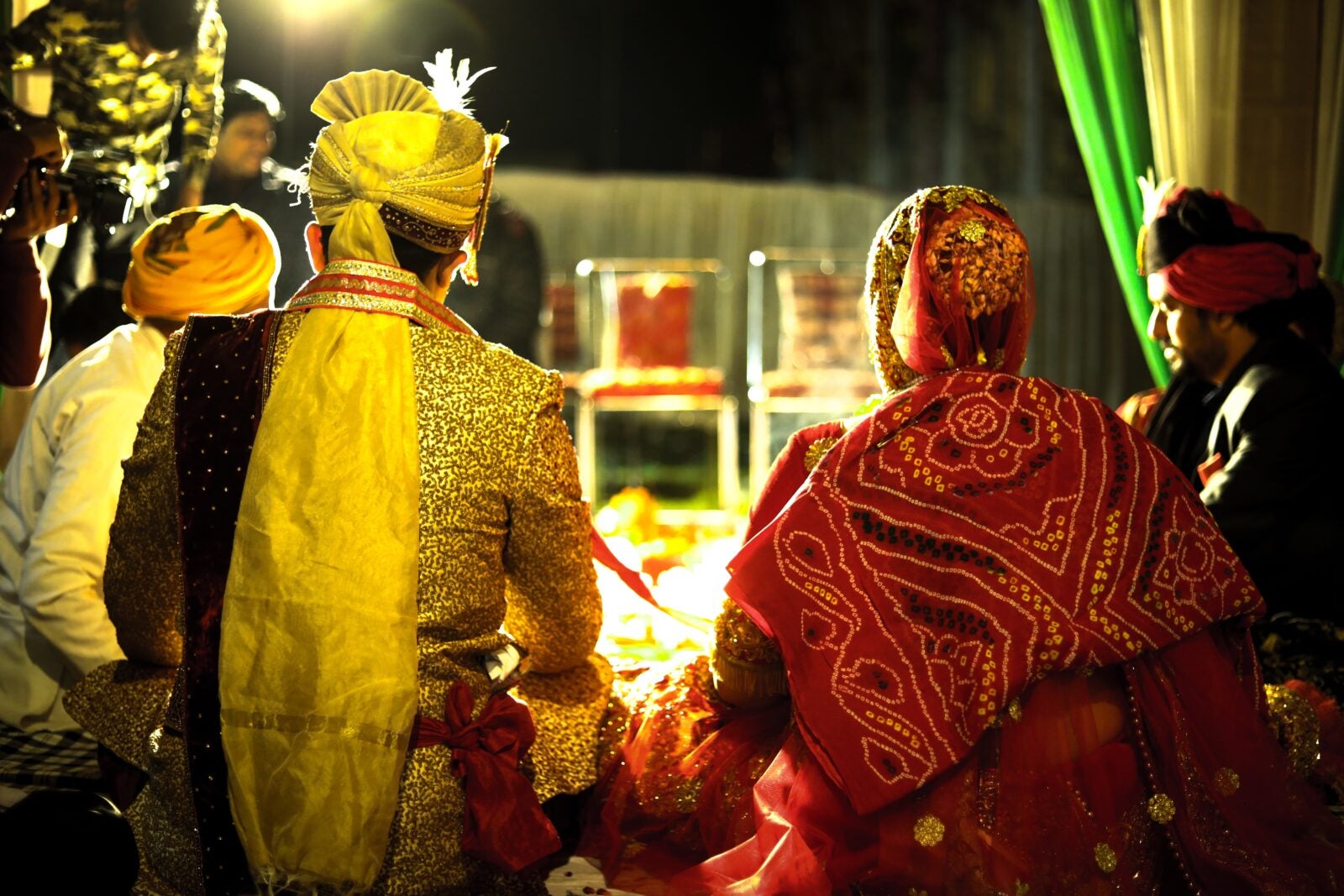 backshot of an Indian couple getting married.