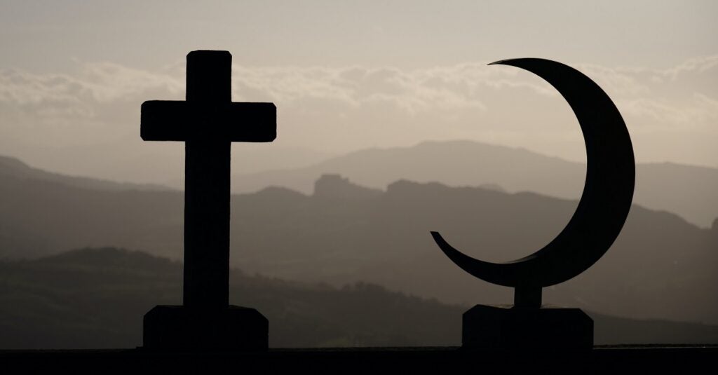 A cross and a crescent. Image via Unsplash.
