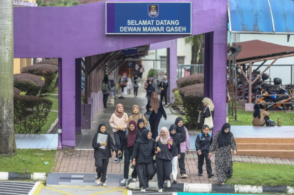 Students dressed in black in opposition of proposal to include non bumis in postgrad programme at UiTM
