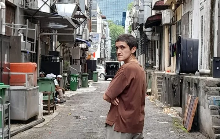 Amar Behind Some Dustbins In An Alley In Kuala Lumpur