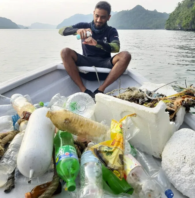 Collecting Rubbish From The Sea